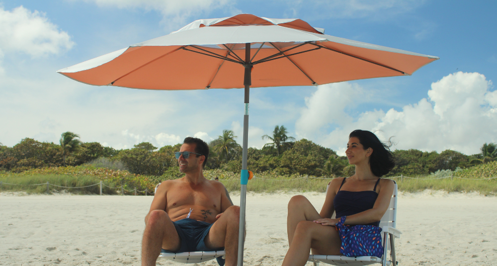 Wind-resistant beach umbrella with a deep steel anchor; silver-lined UPF 55+ canopy