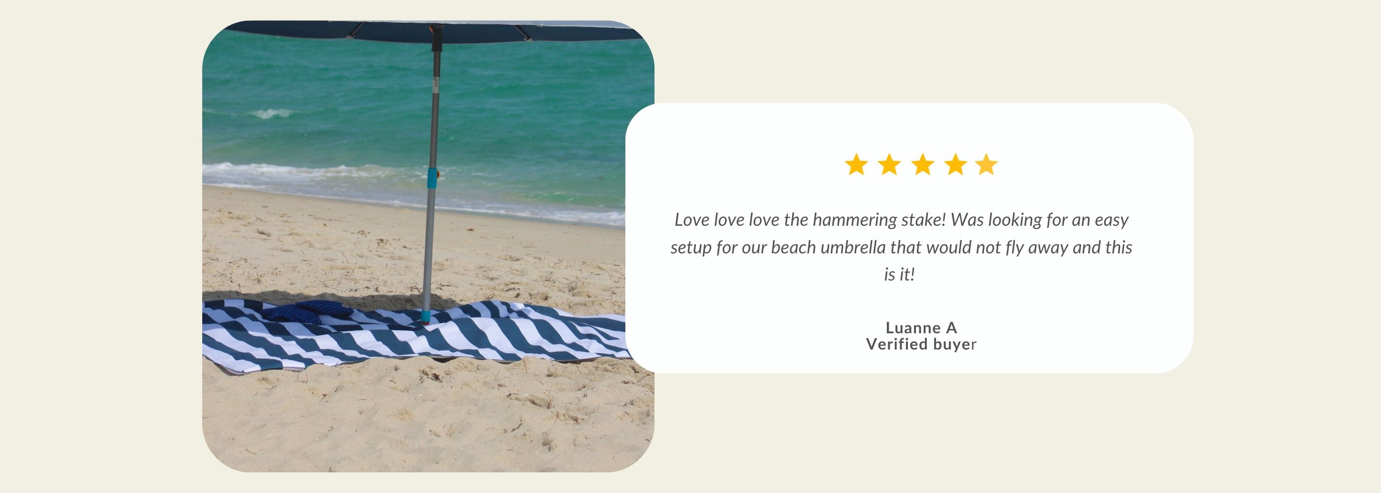 A beach umbrella and towel on sand.| Handy Beach Goods