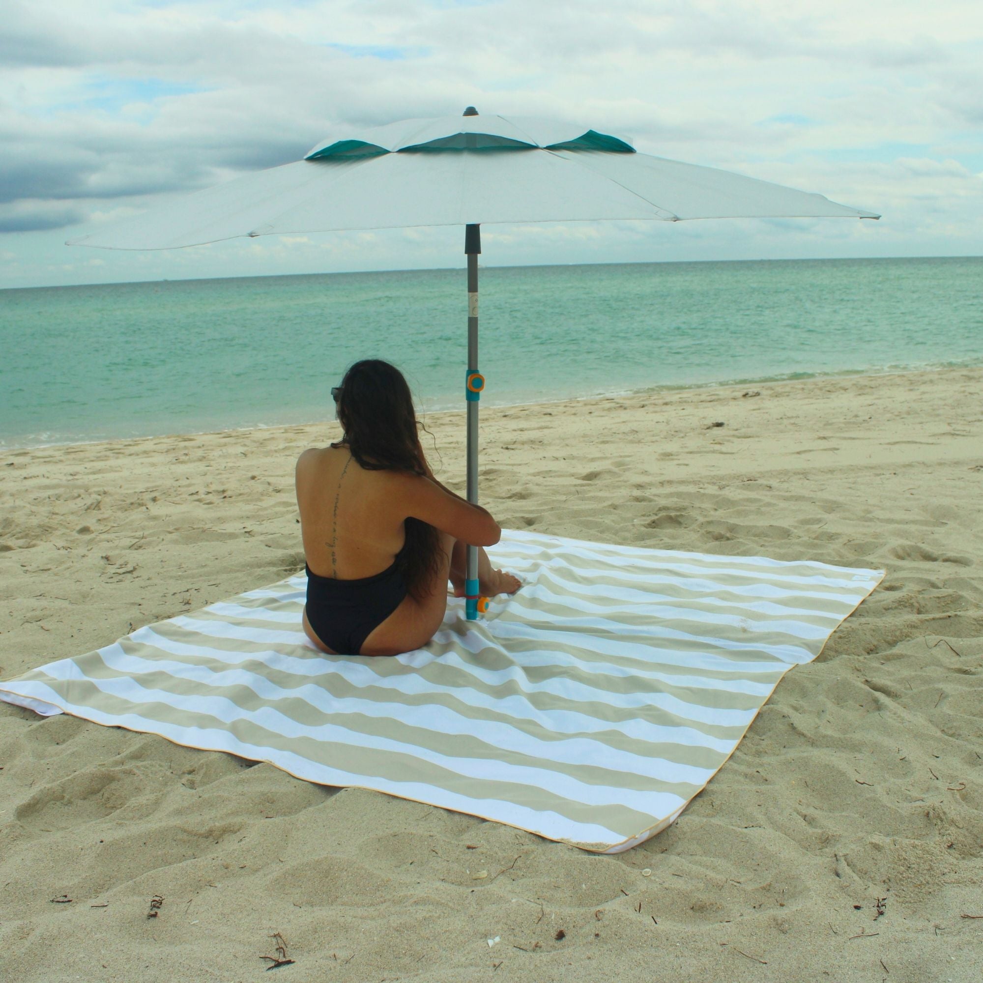 Sand resistant beach blanket with umbrella hole – Handy Beach Goods