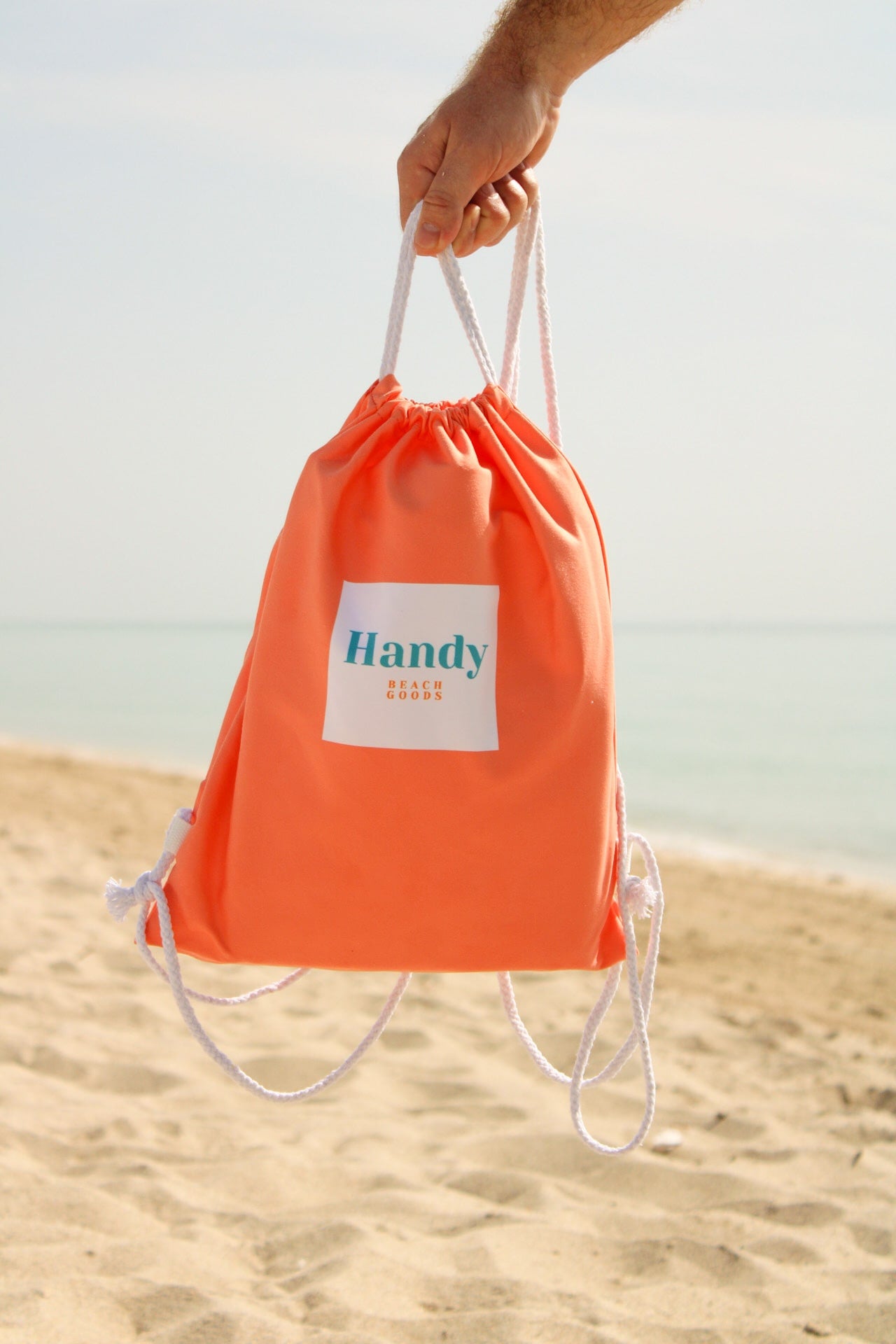 Sand resistant beach blanket with umbrella hole – Handy Beach Goods