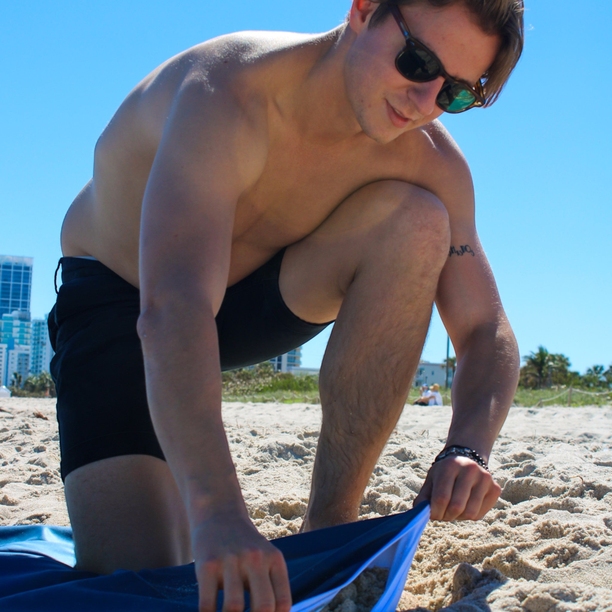 Sand resistant beach blanket with umbrella hole – Handy Beach Goods