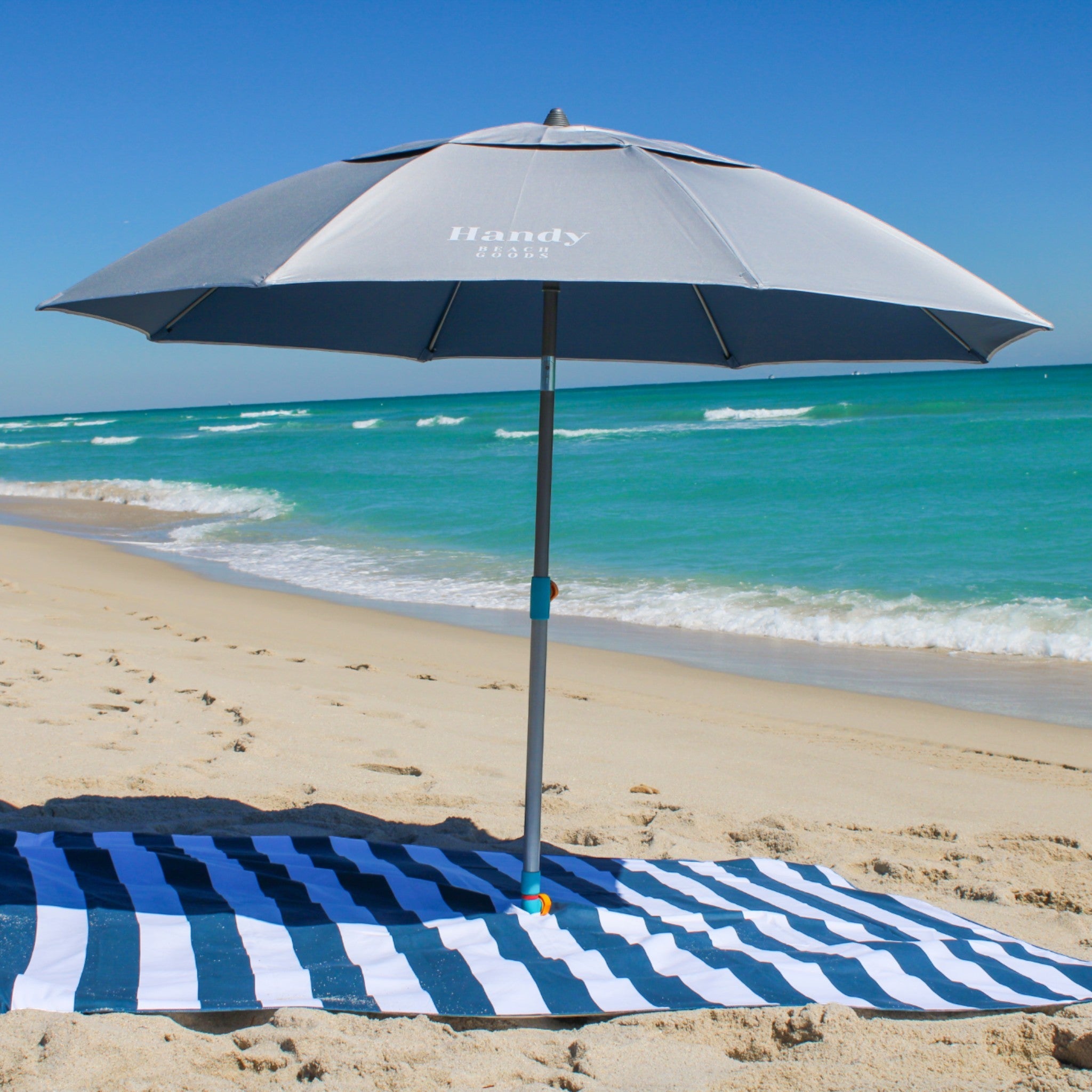 Sand resistant beach blanket with umbrella hole – Handy Beach Goods