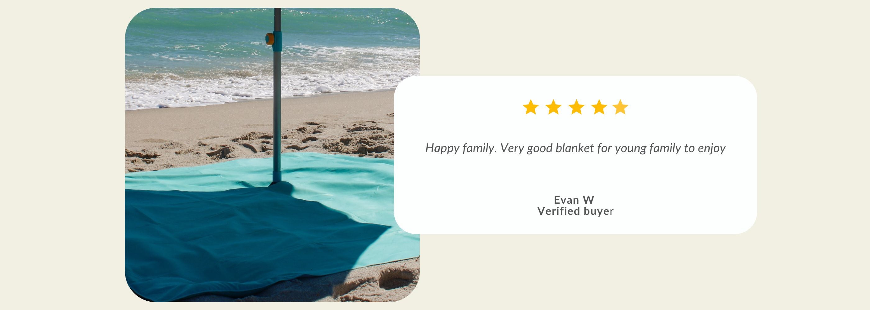 A teal beach blanket on sand.| Handy Beach Goods