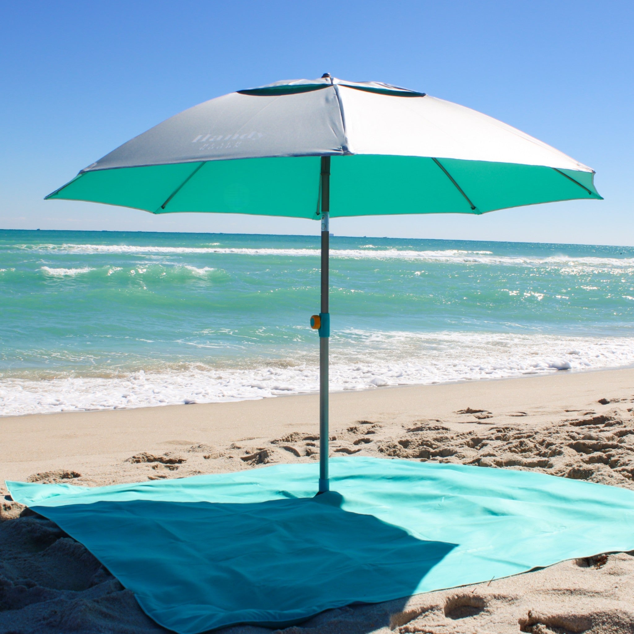 Sand resistant beach blanket with umbrella hole – Handy Beach Goods