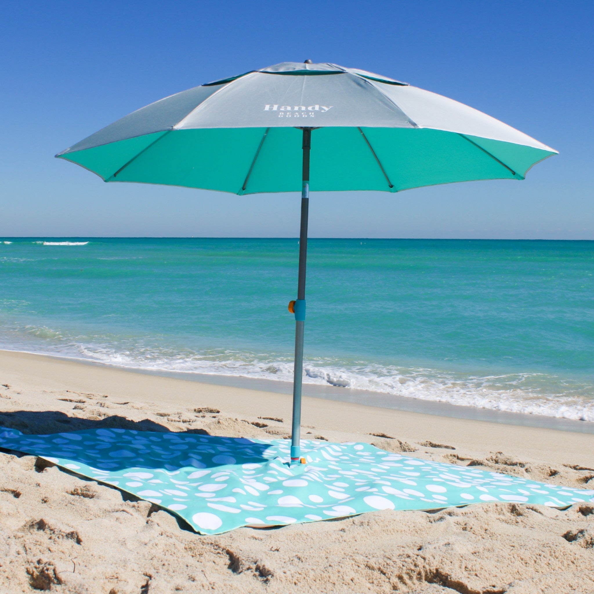 Sand resistant beach blanket with umbrella hole – Handy Beach Goods