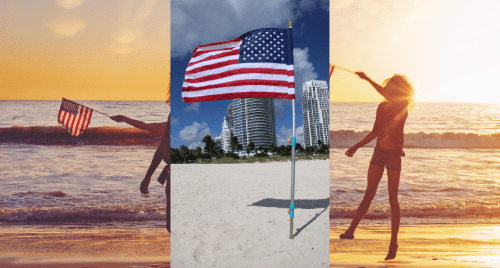 Heavy-duty steel slide-hammer beach anchor being used to firmly secure an American flag in the sand on a crowded beach for the July 4th America 250 celebration.