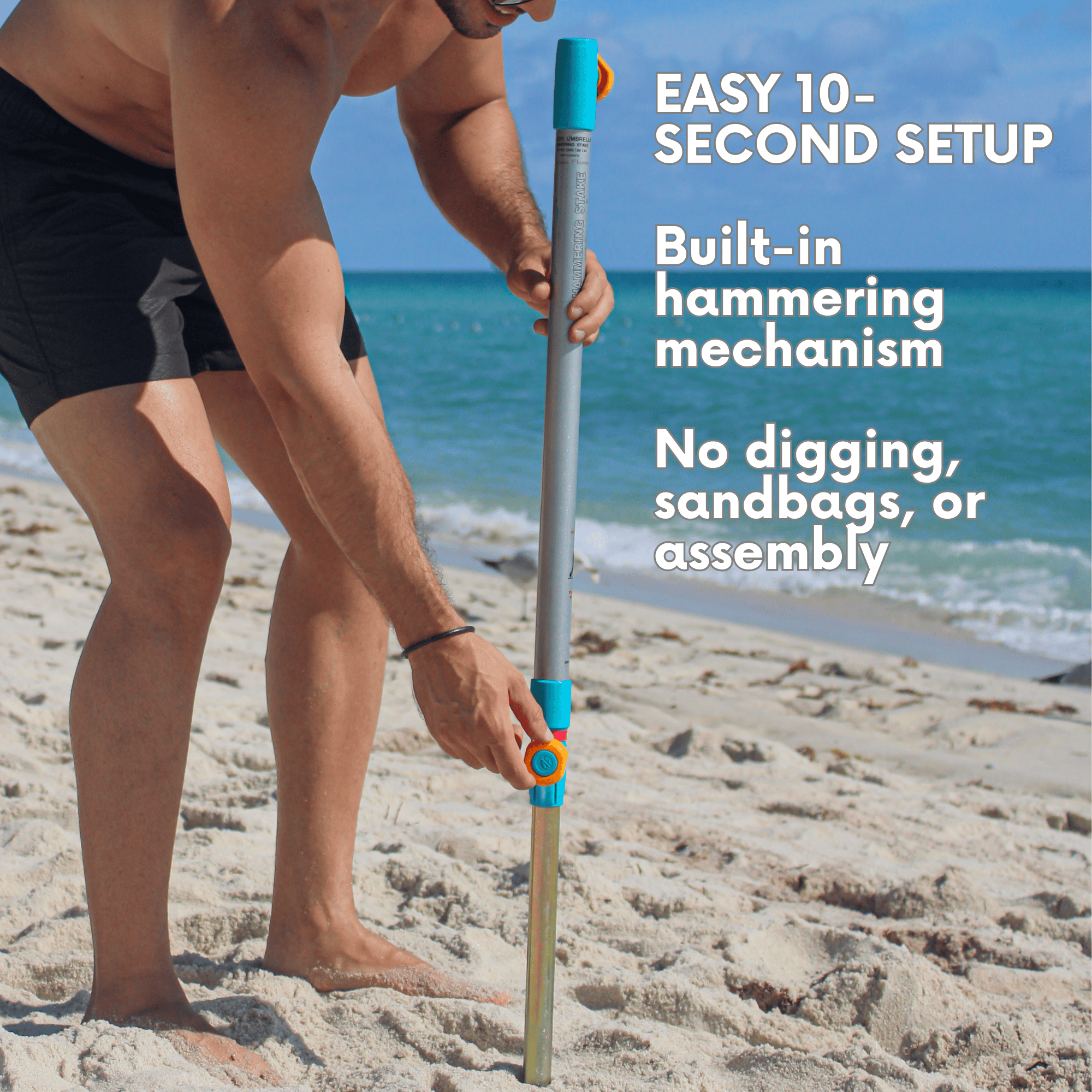Close-up of the built-in heavy-duty sand anchor on the silver and peach beach umbrella, featuring a hammer-in mechanism for fast and easy setup in the sand. peach umbrella system 