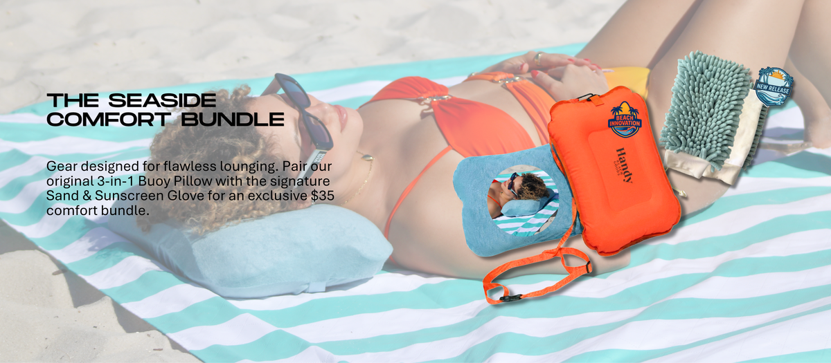A woman lying on a striped beach towel wearing sunglasses and an orange bikini top, with a blue inflatable pillow, a green sand glove. Text on the left reads 'THE SEASIDE COMFORT BUNDLE'.