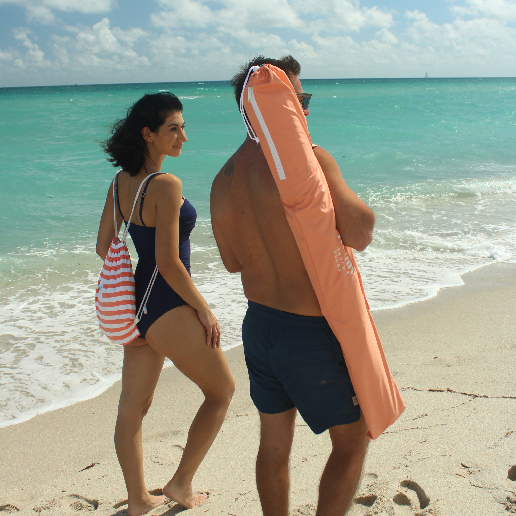 Durable beach umbrella carry bag featuring a padded shoulder strap for comfort and two reinforced storage pockets.