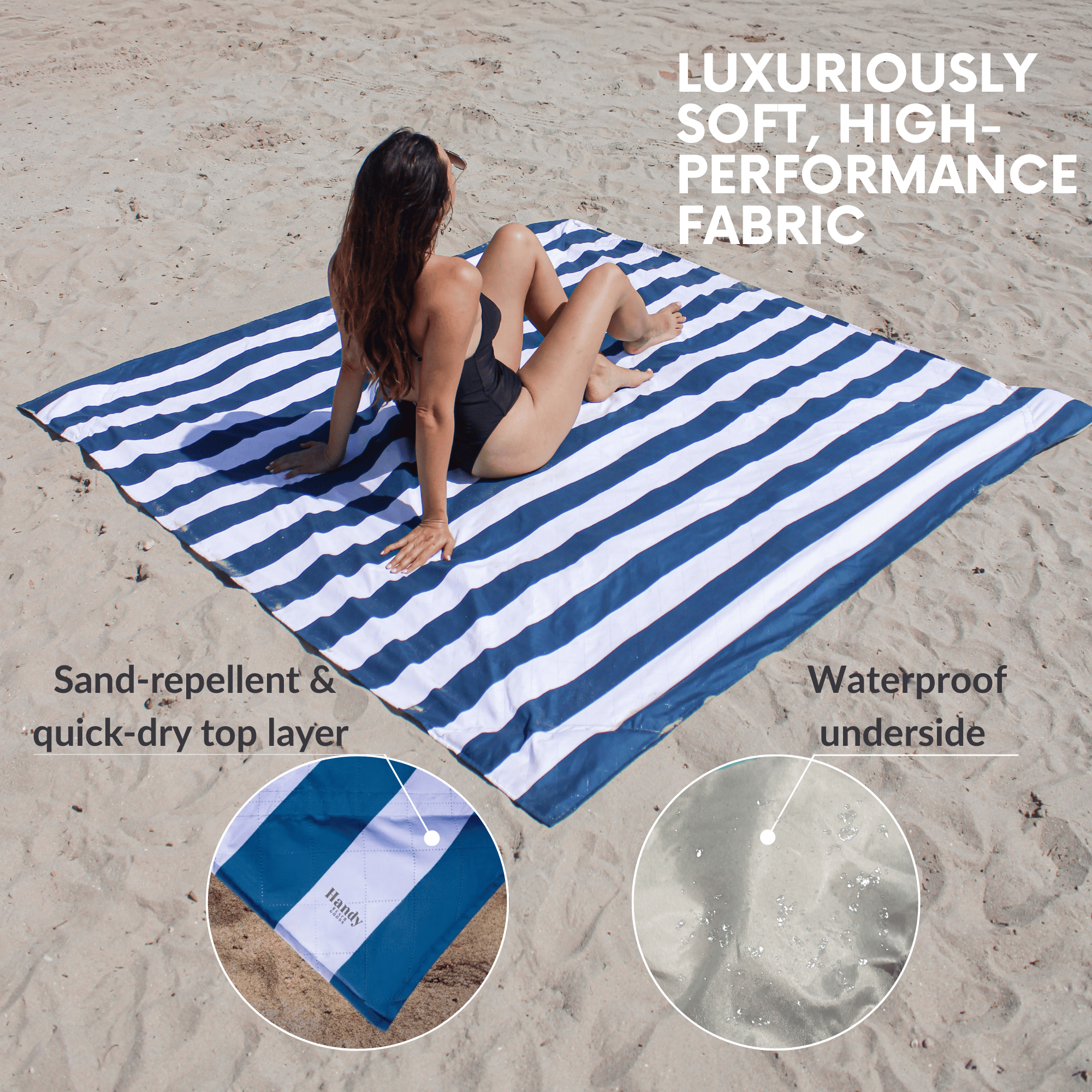 Woman sitting on a blue and white striped beach blanket that is sand-repellant and has waterproof underside