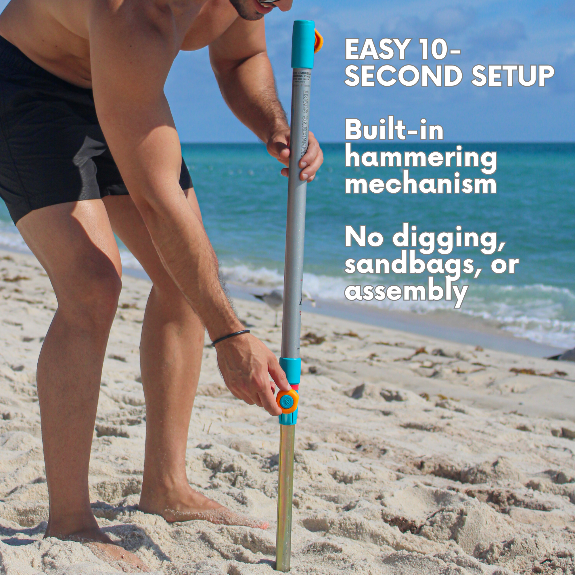 Close-up of the built-in heavy-duty sand anchor on the silver and blue beach umbrella, featuring an integrated hammer-in anchor for fast and easy setup in the sand.